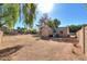 Backyard with two sheds and partial house view at 4027 E Pueblo Ave, Mesa, AZ 85206