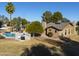 Home with solar panels, pool, gazebo, and lush landscaping at 4027 E Pueblo Ave, Mesa, AZ 85206