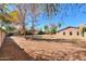 Large backyard with mature trees and grassy area at 4027 E Pueblo Ave, Mesa, AZ 85206