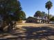 Spacious backyard with storage shed and mature trees at 4027 E Pueblo Ave, Mesa, AZ 85206