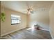 Bedroom with ceiling fan and wood-look floors at 4027 E Pueblo Ave, Mesa, AZ 85206