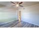 Bright bedroom with ceiling fan and wood-look floors at 4027 E Pueblo Ave, Mesa, AZ 85206