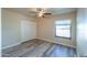 Bedroom with ceiling fan and double door closet at 4027 E Pueblo Ave, Mesa, AZ 85206