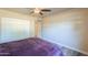 Bedroom with ceiling fan and double door closet at 4027 E Pueblo Ave, Mesa, AZ 85206