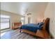 Bright bedroom featuring wood flooring and ample natural light at 4027 E Pueblo Ave, Mesa, AZ 85206