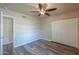 Bedroom with ceiling fan and double door closet at 4027 E Pueblo Ave, Mesa, AZ 85206