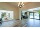 Dining room with chandelier, view of kitchen and pool at 4027 E Pueblo Ave, Mesa, AZ 85206