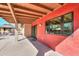 Red exterior wall with new windows and covered patio at 4027 E Pueblo Ave, Mesa, AZ 85206