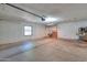 Empty garage with concrete floor and storage cabinets at 4027 E Pueblo Ave, Mesa, AZ 85206