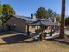 Covered patio gazebo with seating area and solar panels at 4027 E Pueblo Ave, Mesa, AZ 85206