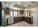 L-shaped kitchen with granite counters, stainless steel appliances, and pool view at 4027 E Pueblo Ave, Mesa, AZ 85206