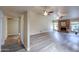 Spacious living room with brick fireplace and wood-look flooring at 4027 E Pueblo Ave, Mesa, AZ 85206