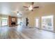 Living room with brick fireplace and access to the courtyard at 4027 E Pueblo Ave, Mesa, AZ 85206