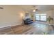 Bright living room with wood-look floors and large windows at 4027 E Pueblo Ave, Mesa, AZ 85206