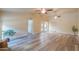 Living area with wood-like flooring, french doors and plant at 4027 E Pueblo Ave, Mesa, AZ 85206