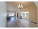 Spacious living room with high ceilings, chandelier, and view of courtyard fountain at 4027 E Pueblo Ave, Mesa, AZ 85206