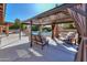 Covered patio with comfortable seating and string lights at 4027 E Pueblo Ave, Mesa, AZ 85206