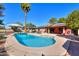 Inviting kidney-shaped pool with built-in spa and diving board at 4027 E Pueblo Ave, Mesa, AZ 85206