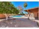 Expansive backyard with a refreshing pool and lush landscaping at 4027 E Pueblo Ave, Mesa, AZ 85206