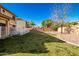 Spacious backyard with grassy area and trees at 4332 E Vallejo Ct, Gilbert, AZ 85298