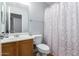 Bathroom with shower/tub combo and floral shower curtain at 4332 E Vallejo Ct, Gilbert, AZ 85298