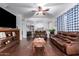 Relaxing living room with dark hardwood floors and comfortable seating at 4332 E Vallejo Ct, Gilbert, AZ 85298