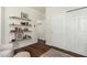 Hallway with floating shelves, showcasing decorative items and books at 4608 N 12Th Pl, Phoenix, AZ 85014