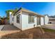 Backyard view of the house with a small patio at 4608 N 12Th Pl, Phoenix, AZ 85014