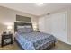 Well-lit bedroom with a queen-size bed and ample closet space at 4704 E Paradise Village N Pkwy # 239, Phoenix, AZ 85032