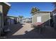 Large backyard with gravel surface, storage shed, and a view of the pool area at 4938 W Michelle Dr, Glendale, AZ 85308