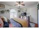 Bedroom with a queen bed, TV, and an arched window at 4938 W Michelle Dr, Glendale, AZ 85308