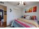 Bright bedroom with a queen-size bed and colorful bedding at 4938 W Michelle Dr, Glendale, AZ 85308