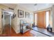 Bright entryway with hardwood floors and decorative console table at 4938 W Michelle Dr, Glendale, AZ 85308