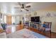 Inviting living room with hardwood floors, fireplace and large windows at 4938 W Michelle Dr, Glendale, AZ 85308