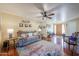 Bright and airy living room with hardwood floors and access to the backyard at 4938 W Michelle Dr, Glendale, AZ 85308