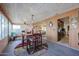 Sunroom dining area with access to the kitchen at 4938 W Michelle Dr, Glendale, AZ 85308