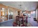 Sunroom with dining table and view of living room at 4938 W Michelle Dr, Glendale, AZ 85308