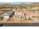 Aerial view of a two-story home with a tile roof and landscaped yard at 518 E Balao Dr, Phoenix, AZ 85085