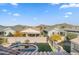 Aerial view of homes with a pool and desert mountain backdrop at 518 E Balao Dr, Phoenix, AZ 85085