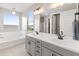 Double vanity bathroom with soaking tub and large mirror at 518 E Balao Dr, Phoenix, AZ 85085