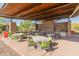 Community outdoor kitchen and dining area with grills and tables at 518 E Balao Dr, Phoenix, AZ 85085