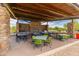 Community outdoor kitchen and dining area with grills and tables at 518 E Balao Dr, Phoenix, AZ 85085