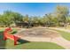 Community spinner play area with benches at 518 E Balao Dr, Phoenix, AZ 85085