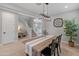 Dining area with a farmhouse table, stairs, and access to the living room at 518 E Balao Dr, Phoenix, AZ 85085