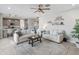 Comfortable living room with adjacent kitchen and a view of the stairs at 518 E Balao Dr, Phoenix, AZ 85085