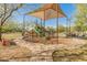 Community playground with shade structure and play equipment at 518 E Balao Dr, Phoenix, AZ 85085