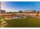 Relaxing pool area featuring a kidney-shaped pool and lounge chairs at 518 E Balao Dr, Phoenix, AZ 85085