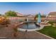 Relaxing pool with string lights and lounge chairs in a beautifully landscaped yard at 518 E Balao Dr, Phoenix, AZ 85085