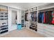 Large walk-in closet with ample shelving and drawers at 518 E Balao Dr, Phoenix, AZ 85085