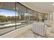 Living area with curved window and pool view at 5301 E Calle Del Norte --, Phoenix, AZ 85018